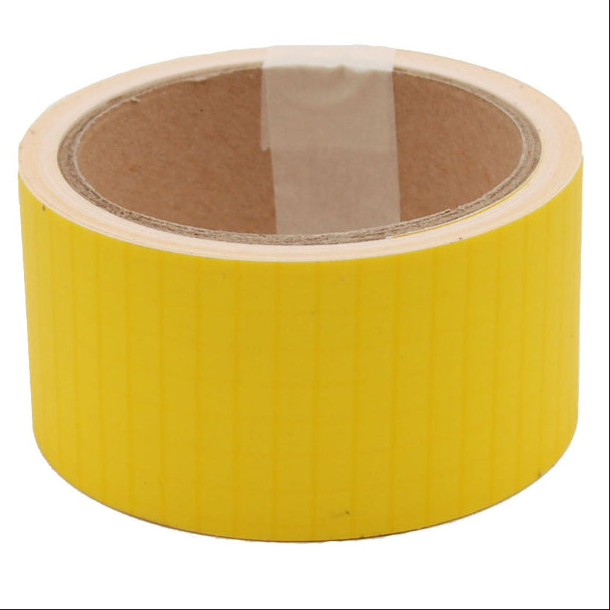 A roll of yellow Bainbridge ripstop nylon sail repair tape, 2 inches wide, against a white background.